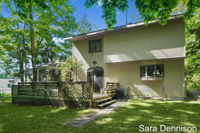 1026 Alan St, Fremont, MI 49412 - rear view of house featuring a lawn, a wooden deck, and a gazebo