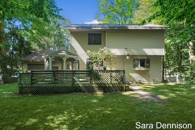 1026 Alan St, Fremont, MI 49412 - rear view of house featuring a yard and a wooden deck
