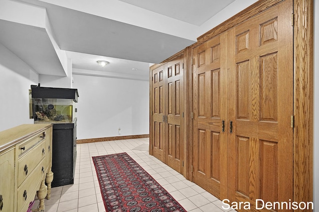 1026 Alan St, Fremont, MI 49412 - hallway with light tile patterned floors and baseboards