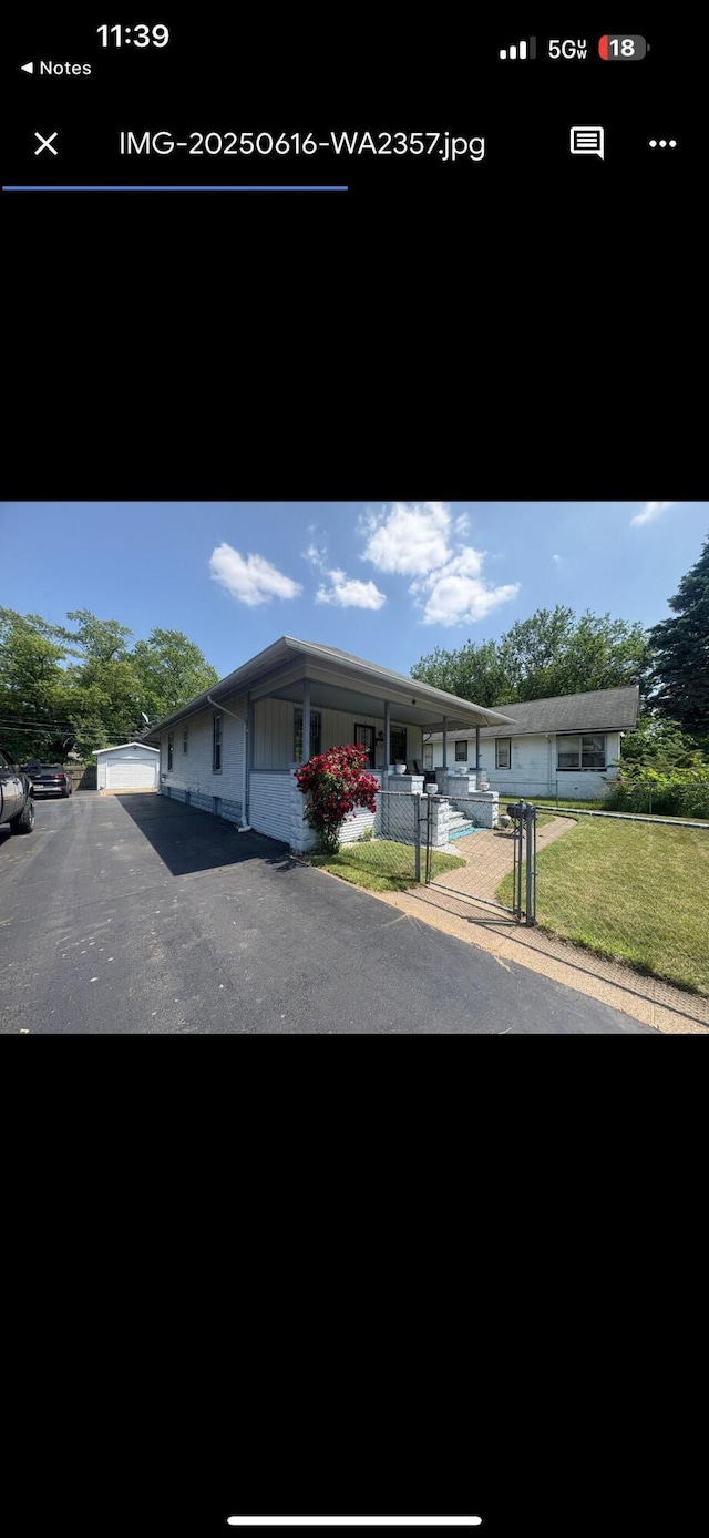 863 Colfax Ave, Benton Harbor, MI 49022 - view of front of house with a gate