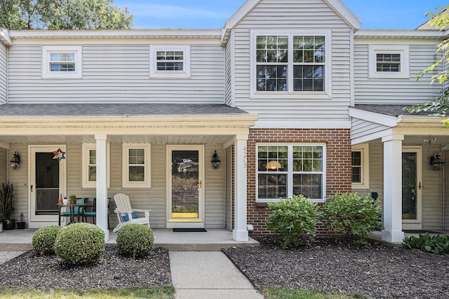 4273 Sawkaw Dr NE, Grand Rapids, MI 49525 - view of property featuring a porch and brick siding