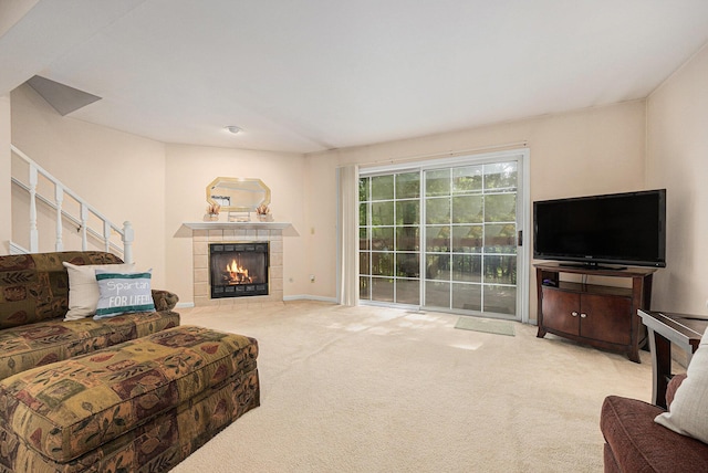 4273 Sawkaw Dr NE, Grand Rapids, MI 49525 - carpeted living room featuring a tiled fireplace and baseboards