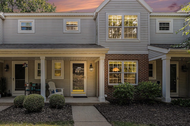 4273 Sawkaw Dr NE, Grand Rapids, MI 49525 - view of front of home with covered porch and brick siding