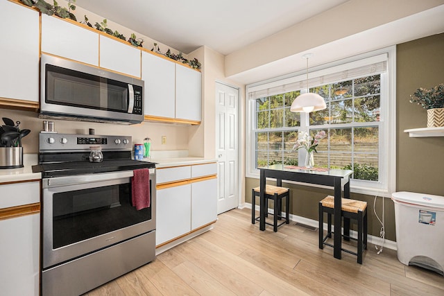 4273 Sawkaw Dr NE, Grand Rapids, MI 49525 - kitchen with stainless steel appliances, light countertops, and light wood-type flooring