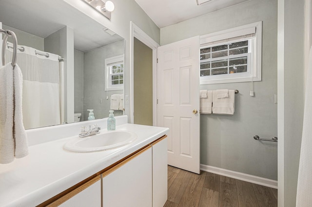 4273 Sawkaw Dr NE, Grand Rapids, MI 49525 - bathroom with wood finished floors and vanity