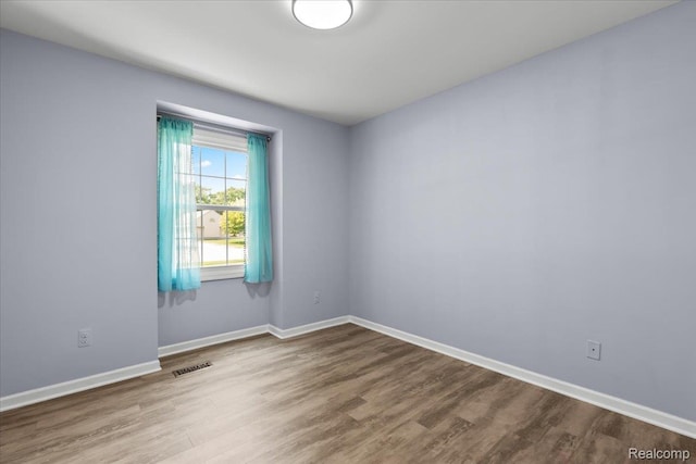 24690 Bashian Dr, Novi, MI 48375 - spare room with wood finished floors