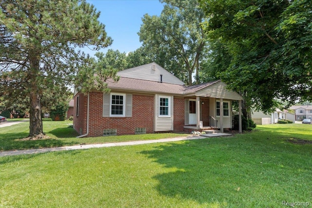 24690 Bashian Dr, Novi, MI 48375 - view of front facade with brick siding, a front lawn, and roof with shingles