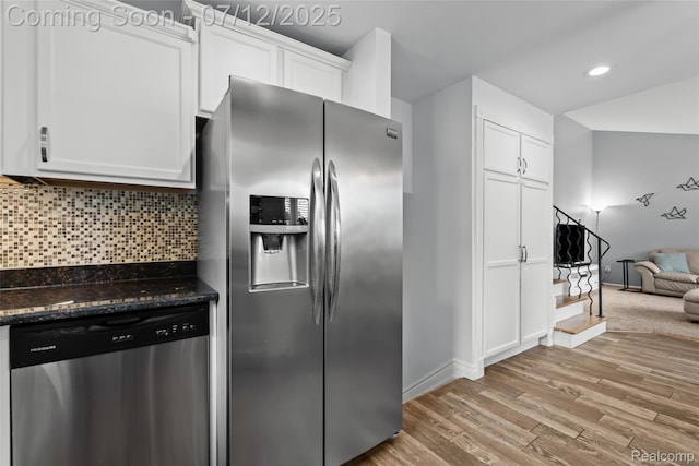 1450 N Stephen Ave, Clawson, MI 48017 - kitchen featuring appliances with stainless steel finishes, light wood-type flooring, white cabinets, decorative backsplash, and recessed lighting