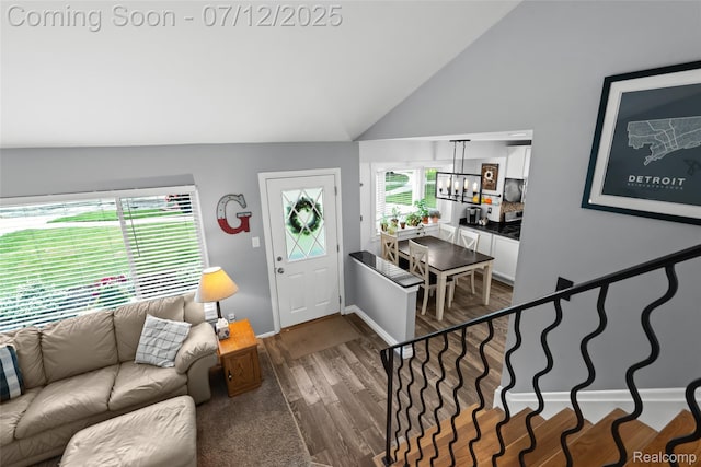 1450 N Stephen Ave, Clawson, MI 48017 - foyer entrance with vaulted ceiling, dark wood-style floors, and a chandelier