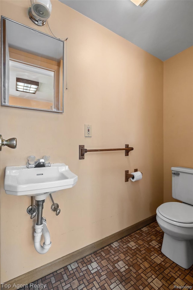 23123 E 13 Mile Rd, Saint Clair Shores, MI 48082 - bathroom with toilet and brick patterned flooring