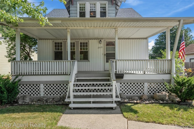 23123 E 13 Mile Rd, Saint Clair Shores, MI 48082 - view of front of property with covered porch and a shingled roof