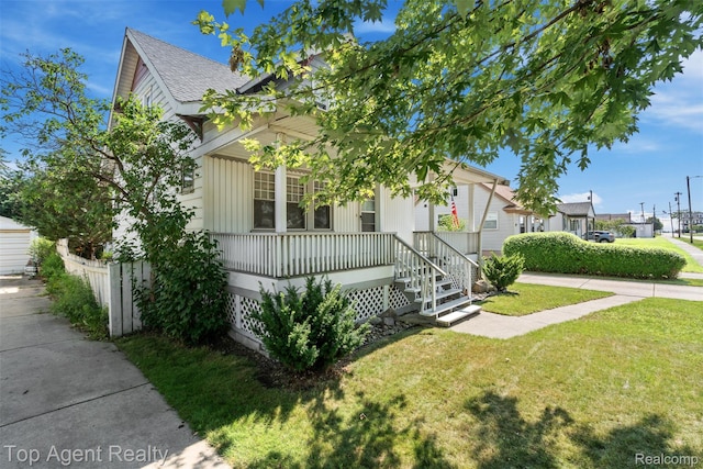 23123 E 13 Mile Rd, Saint Clair Shores, MI 48082 - view of front of house with a porch, a front lawn, and a shingled roof
