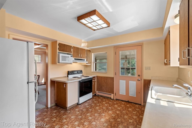 23123 E 13 Mile Rd, Saint Clair Shores, MI 48082 - kitchen featuring white appliances, a baseboard radiator, under cabinet range hood, light countertops, and brown cabinets