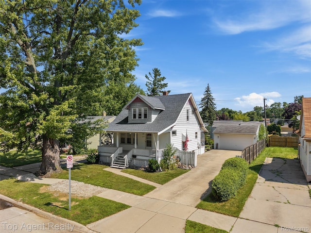 23123 E 13 Mile Rd, Saint Clair Shores, MI 48082 - bungalow-style house featuring a porch, roof with shingles, an outbuilding, and a detached garage