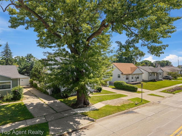 23123 E 13 Mile Rd, Saint Clair Shores, MI 48082 - view of front of house with concrete driveway, a front lawn, a garage, and a residential view