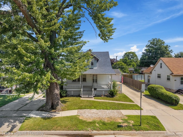 23123 E 13 Mile Rd, Saint Clair Shores, MI 48082 - view of front of house with driveway, covered porch, and roof with shingles