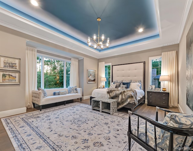 160 Darling Dr, Lake Orion, MI 48362 - bedroom with a chandelier, a raised ceiling, recessed lighting, and wood finished floors