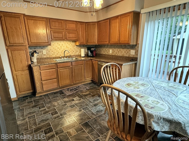 32120 Glen St, Westland, MI 48186 - kitchen featuring brown cabinetry, decorative backsplash, dark countertops, and stainless steel dishwasher