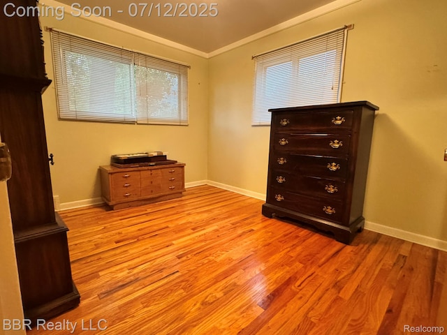 32120 Glen St, Westland, MI 48186 - bedroom featuring light wood-type flooring and crown molding