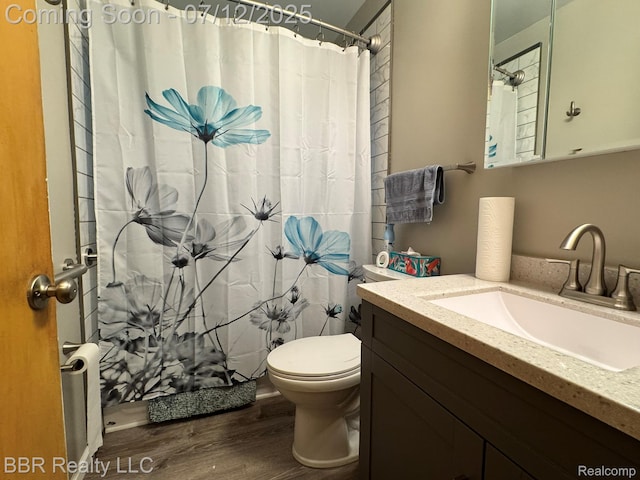 32120 Glen St, Westland, MI 48186 - full bath featuring wood finished floors, vanity, and a shower with shower curtain