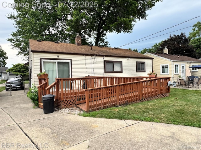 32120 Glen St, Westland, MI 48186 - rear view of property with a deck, a yard, and a chimney