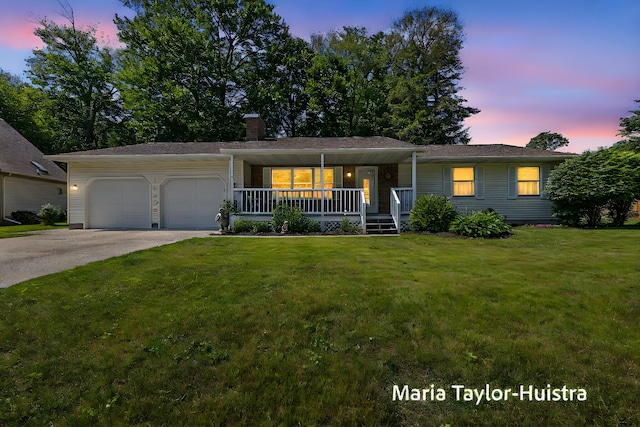 16205 Suffolk Dr, Spring Lake, MI 49456 - single story home with covered porch, a garage, driveway, and a yard