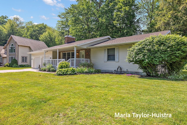 16205 Suffolk Dr, Spring Lake, MI 49456 - view of front of home featuring a porch, an attached garage, a chimney, a front lawn, and driveway