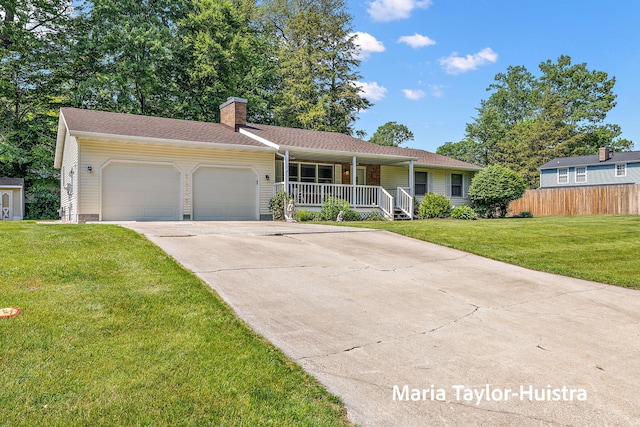 16205 Suffolk Dr, Spring Lake, MI 49456 - ranch-style home with a porch, an attached garage, a chimney, concrete driveway, and roof with shingles