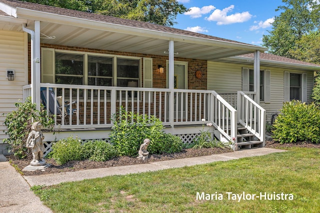 16205 Suffolk Dr, Spring Lake, MI 49456 - entrance to property featuring a porch and a shingled roof