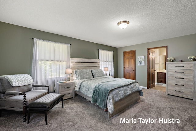 16205 Suffolk Dr, Spring Lake, MI 49456 - carpeted bedroom with a textured ceiling and ensuite bath