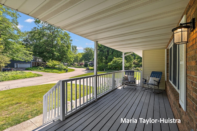 16205 Suffolk Dr, Spring Lake, MI 49456 - wooden porch with a yard and view of wooded area