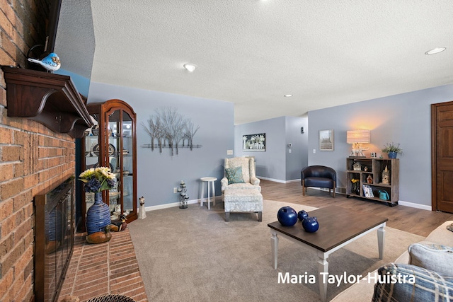16205 Suffolk Dr, Spring Lake, MI 49456 - living room featuring a brick fireplace, recessed lighting, and a textured ceiling