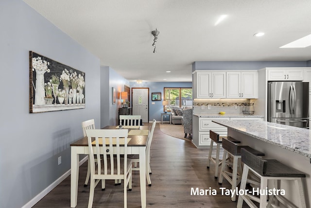 16205 Suffolk Dr, Spring Lake, MI 49456 - dining room with dark wood finished floors, recessed lighting, and a skylight