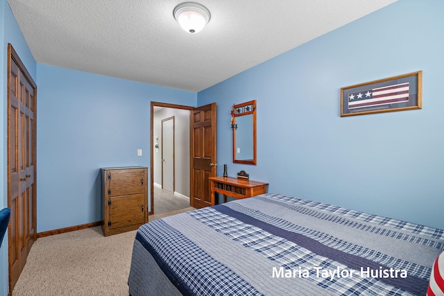 16205 Suffolk Dr, Spring Lake, MI 49456 - bedroom featuring a textured ceiling, a closet, and light carpet