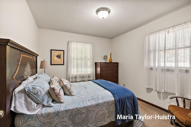 16205 Suffolk Dr, Spring Lake, MI 49456 - carpeted bedroom featuring a textured ceiling and baseboards