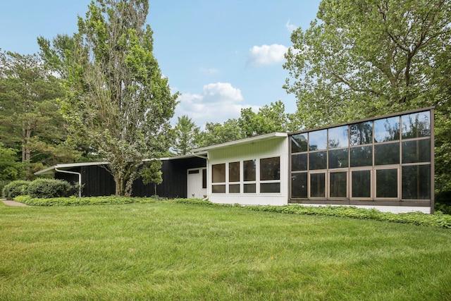 2373 Belgrade Notch St, Ann Arbor, MI 48103 - rear view of house featuring a lawn and a carport