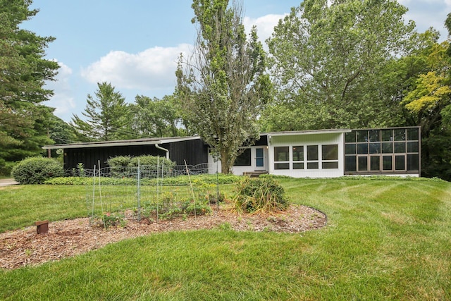 2373 Belgrade Notch St, Ann Arbor, MI 48103 - rear view of house featuring a yard