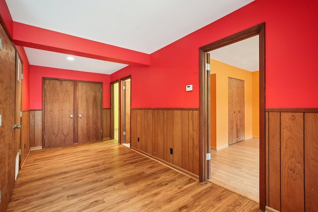 2373 Belgrade Notch St, Ann Arbor, MI 48103 - unfurnished bedroom featuring a wainscoted wall, wood finished floors, and wooden walls