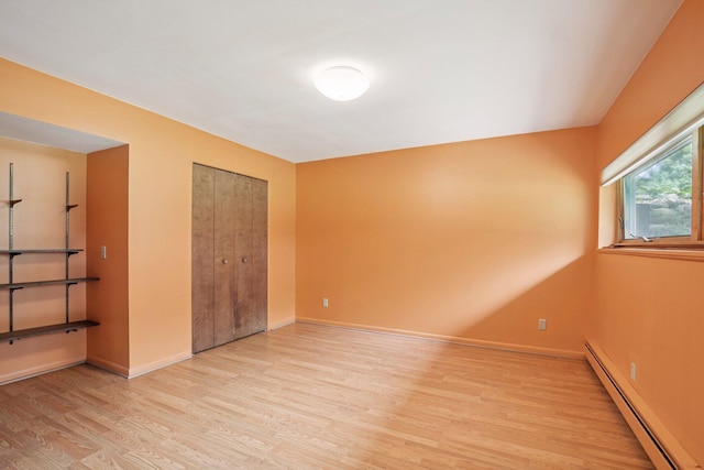 2373 Belgrade Notch St, Ann Arbor, MI 48103 - empty room with a baseboard radiator and light wood-style floors