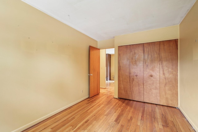 2373 Belgrade Notch St, Ann Arbor, MI 48103 - unfurnished bedroom featuring light wood-type flooring and a closet