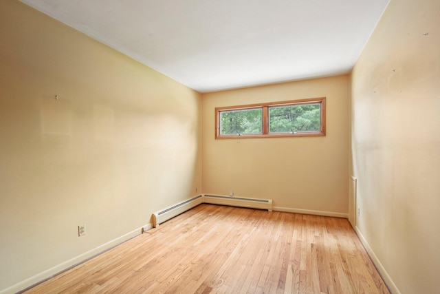 2373 Belgrade Notch St, Ann Arbor, MI 48103 - spare room featuring light wood finished floors and a baseboard radiator