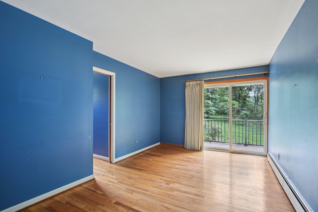 2373 Belgrade Notch St, Ann Arbor, MI 48103 - empty room featuring a baseboard radiator and wood finished floors
