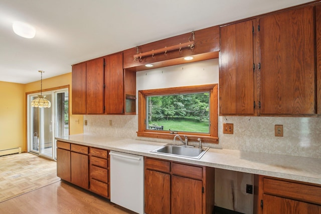 2373 Belgrade Notch St, Ann Arbor, MI 48103 - kitchen with dishwasher, light countertops, and decorative backsplash