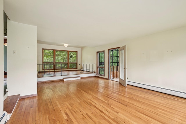 2373 Belgrade Notch St, Ann Arbor, MI 48103 - spare room with light wood-type flooring and a baseboard radiator