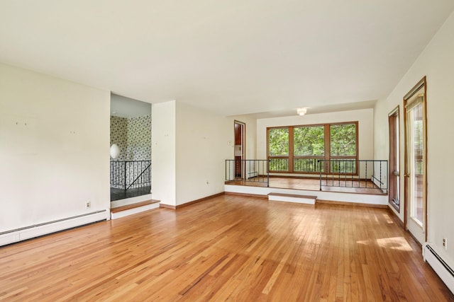 2373 Belgrade Notch St, Ann Arbor, MI 48103 - unfurnished living room with baseboard heating and light wood-type flooring