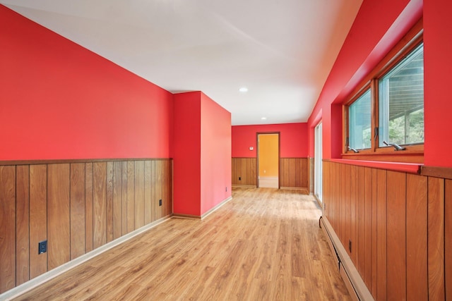 2373 Belgrade Notch St, Ann Arbor, MI 48103 - empty room featuring a wainscoted wall, wood finished floors, a baseboard radiator, wooden walls, and recessed lighting
