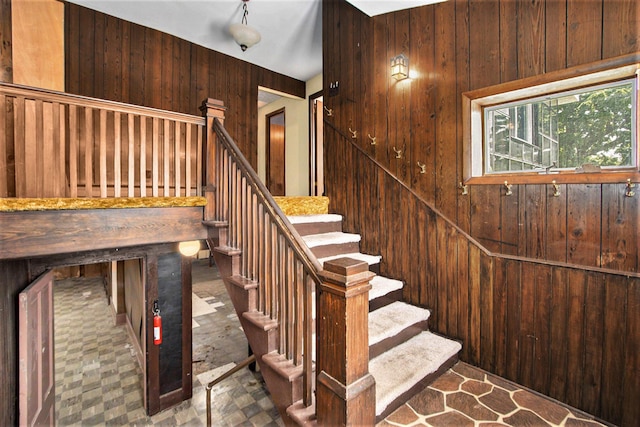 258 Division St, Eastlake, MI 49626 - stairway featuring tile patterned floors and wooden walls