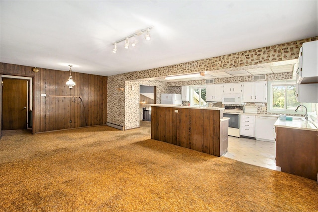 258 Division St, Eastlake, MI 49626 - kitchen with white appliances, wallpapered walls, white cabinets, light countertops, and open floor plan
