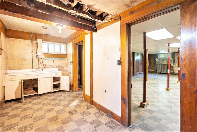 258 Division St, Eastlake, MI 49626 - below grade area featuring light flooring and radiator heating unit