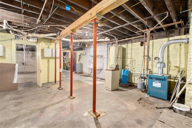 258 Division St, Eastlake, MI 49626 - unfinished basement with a water pressure tank and a heating unit